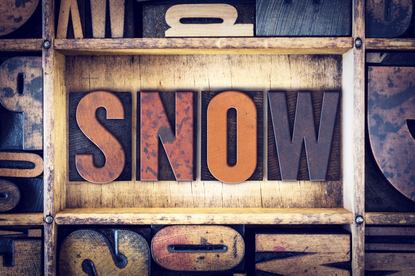 The word "Snow" written in vintage wooden letterpress type.